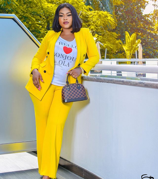 Curvy Daniella Okeke trends with rare bright yellow matchup suit