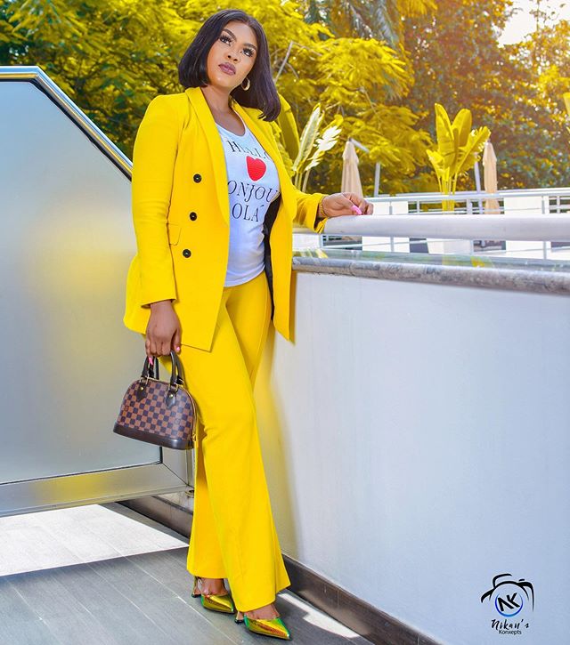 Curvy Daniella Okeke trends with rare bright yellow matchup suit